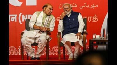 Prime Minister Narendra Modi with Union defence minister and the BJP’s Lucknow Lok Sabha candidate Rajnath Singh at the BJP headquarters in New Delhi on Tuesday. (Bloomberg)
