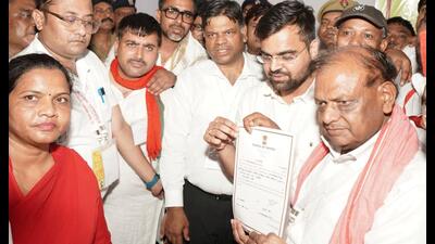SP’s RK Chaudhary, who won the Mohanlalganj Lok Sabha seat, after receiving his certificate of victory from Lucknow district magistrate Surya Pal Gangwar on June 4. (Sourced) SP’s RK Chaudhary, who won the Mohanlalganj Lok Sabha seat, after receiving his certificate of victory from Lucknow district magistrate Surya Pal Gangwar on June 4. (Sourced)