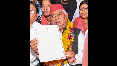 Samajwadi Party (SP) candidate from Faizabad constituency Awadhesh Prasad shows his certificate after winning the Lok Sabha elections, at Government Inter College, in Ayodhya (PTI) Samajwadi Party (SP) candidate from Faizabad constituency Awadhesh Prasad shows his certificate after winning the Lok Sabha elections, at Government Inter College, in Ayodhya (PTI)