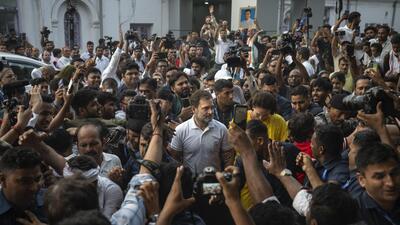 Senior Congress leader Rahul Gandhi surrounded by workers in Delhi on Tuesday. (AP) Senior Congress leader Rahul Gandhi surrounded by workers in Delhi on Tuesday. (AP)