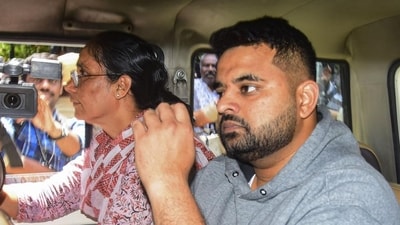 Suspended JD(S) MP Prajwal Revanna, facing allegations of sexually abusing several women, being taken to a hospital for medical examination under tight security, in Bengaluru on Friday. (PTI) Suspended JD(S) MP Prajwal Revanna, facing allegations of sexually abusing several women, being taken to a hospital for medical examination under tight security, in Bengaluru on Friday. (PTI)