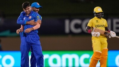 Afghanistan's Fazalhaq Farooqi, left, celebrates with a teammate after taking the wicket of Uganda's Ronak Patel during an ICC Men's T20 World Cup cricket match at Guyana National Stadium in Providence, Guyana (AP) Afghanistan's Fazalhaq Farooqi, left, celebrates with a teammate after taking the wicket of Uganda's Ronak Patel during an ICC Men's T20 World Cup cricket match at Guyana National Stadium in Providence, Guyana (AP)