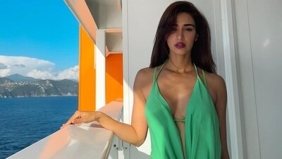 Earlier, Disha Patani posed in a green maxi dress worth <span class='webrupee'>₹</span>1.16 lakh in her first post from the cruise bash. The actor is rumoured to be dating her fitness trainer and friend Aleksander Alex Ilic. Earlier, Disha Patani posed in a green maxi dress worth <span class='webrupee'>₹</span>1.16 lakh in her first post from the cruise bash. The actor is rumoured to be dating her fitness trainer and friend Aleksander Alex Ilic. 