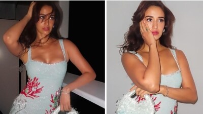 Disha Patani has posted new pictures from Anant Ambani-Radhika Merchant's pre-wedding cruise party. The actor posed in a sea-blue mini dressed paired with matching purse. Disha Patani has posted new pictures from Anant Ambani-Radhika Merchant's pre-wedding cruise party. The actor posed in a sea-blue mini dressed paired with matching purse.
