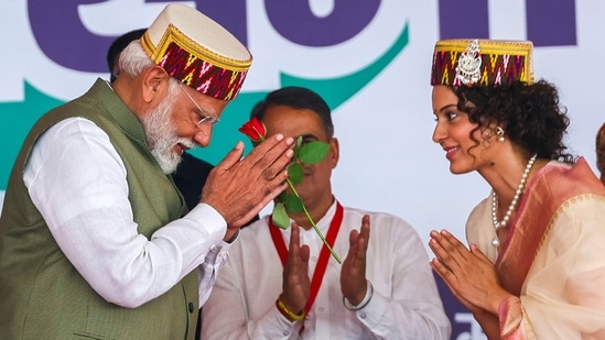 Prime Minister Narendra Modi with BJP candidate from Mandi constituency Kangana Ranaut during a public meeting for Lok Sabha elections, in Mandi. (PTI)