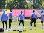 India's Virat Kohli, Sanju Samson and Arshdeep Singh play football during a practice session