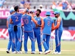 India's Jasprit Bumrah and teammates celebrate the dismissal of Ireland' Harry Tector 
