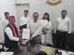 Samajwadi Party chief Akhilesh Yadav receiving his certificate of victory from DM Shubrant Shukla in Kannauj on Wednessday. (HT photo) Samajwadi Party chief Akhilesh Yadav receiving his certificate of victory from DM Shubrant Shukla in Kannauj on Wednessday. (HT photo)