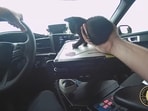 Florida cop driving the car after rescuing the cat from the highway. Florida cop driving the car after rescuing the cat from the highway.