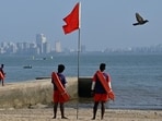 Mumbai, India - May 4, 2024: A lifeguard stands along the coast near Girgaon beach as IMD and Indian National Centre for Ocean Information Services has declared alert for swell surge waves for 36 hours from 4th May to 5th  May, in Mumbai, India, on Saturday, May 4, 2024.  (Photo by Anshuman Poyrekar/ Hindustan Times)