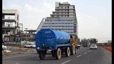 A water tanker on its way to supply water to residential areas at new sectors near the Dwarka Expressway in Gurugram on Wednesday. (Parveen Kumar/HT PHOTO) A water tanker on its way to supply water to residential areas at new sectors near the Dwarka Expressway in Gurugram on Wednesday. (Parveen Kumar/HT PHOTO)