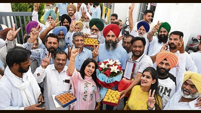 AAP supporters celebrating the victory of Malvinder Singh Kang outside the party office in Mohali on Tuesday. (Sanjeev Sharma/ HT) AAP supporters celebrating the victory of Malvinder Singh Kang outside the party office in Mohali on Tuesday. (Sanjeev Sharma/ HT)