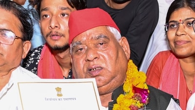 Samajwadi Party (SP) candidate from Faizabad constituency Awadhesh Prasad shows his certificate after winning the Lok Sabha elections, at Government Inter College, in Ayodhya, Tuesday, June 4, 2024. (PTI) Samajwadi Party (SP) candidate from Faizabad constituency Awadhesh Prasad shows his certificate after winning the Lok Sabha elections, at Government Inter College, in Ayodhya, Tuesday, June 4, 2024. (PTI)