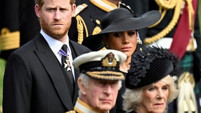 Britain's Meghan, Duchess of Sussex, cries as she, Prince Harry, Duke of Sussex, Queen Camilla and King Charles attend the state funeral and burial of Britain's Queen Elizabeth, in London, Britain, September 19, 2022. (REUTERS)