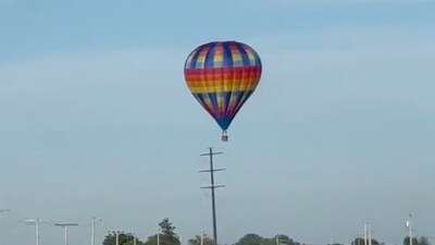 This photo provided by Debbie Wajvoda shows a hot air balloon crashing after hitting a utility pole on Sunday, June 2, 2024 east of Lowell, Ind. Federal investigators are probing the crash in northwestern Indiana that injured three people. Firefighters responded to the crash and found the balloon in a bean field. (Debbie Wajvoda via AP) (AP) This photo provided by Debbie Wajvoda shows a hot air balloon crashing after hitting a utility pole on Sunday, June 2, 2024 east of Lowell, Ind. Federal investigators are probing the crash in northwestern Indiana that injured three people. Firefighters responded to the crash and found the balloon in a bean field. (Debbie Wajvoda via AP) (AP)