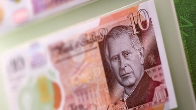 Bank notes and coins that feature an image of Britain's King Charles III are pictured on display. (AFP) Bank notes and coins that feature an image of Britain's King Charles III are pictured on display. (AFP)