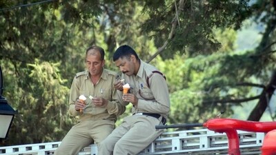 Firefighters enjoying ice cream during a break in Shimla, Himachal. (Deepak Sansta/HT) Firefighters enjoying ice cream during a break in Shimla, Himachal. (Deepak Sansta/HT)