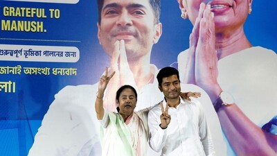 Mamata Banerjee, the chief minister of West Bengal and chief of Trinamool Congress (TMC), and her nephew Abhishek Banerjee. (Reuters)