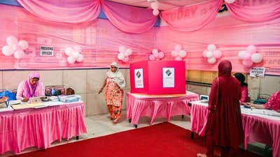 A voter leaves after casting her vote at a polling station during the sixth phase of voting for national elections in Delhi. (Bloomberg)