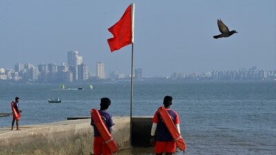 Mumbai, India - May 4, 2024: A lifeguard stands along the coast near Girgaon beach as IMD and Indian National Centre for Ocean Information Services has declared alert for swell surge waves for 36 hours from 4th May to 5th  May, in Mumbai, India, on Saturday, May 4, 2024.  (Photo by Anshuman Poyrekar/ Hindustan Times) (Hindustan Times)