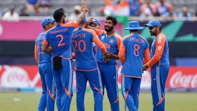 India's Jasprit Bumrah, third from right, is congratulated by teammates after taking the wicket of Ireland's Harry Tector during ICC Men's T20 World Cup (PTI)