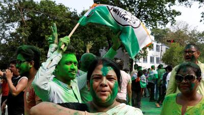 TMC supporters celebrating after the Lok Sabha poll results in Kolkata on June 4. (REUTERS) TMC supporters celebrating after the Lok Sabha poll results in Kolkata on June 4. (REUTERS)