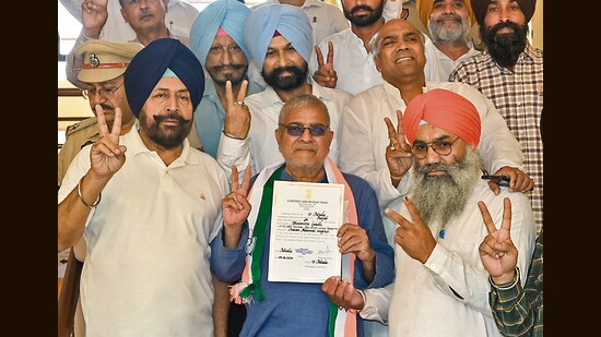 Congress’ Dr Dharamvira Gandhi after receiving the victory certificate at a counting centre in Patiala on Tuesday. (PTI photo)
