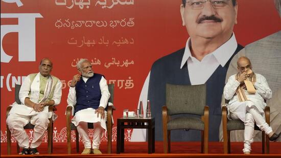 Prime Minister Narendra Modi with defense minister Rajnath Singh and home minister Amit Shah at the Bharatiya Janata Party headquarters in New Delhi on Tuesday. (AP Photo)