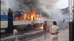 The burning train at Kiul railway station in Lakhisarai district of Bihar on Thursday. (PTI)
