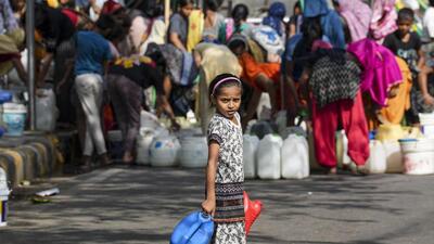 A child waits to collect water from a municipality tanker, at Chanakyapuri area in New Delhi, on Thursday. (PTI) A child waits to collect water from a municipality tanker, at Chanakyapuri area in New Delhi, on Thursday. (PTI)