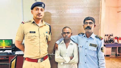 Arjun Kumar (middle) with his father Ganhori Das, who works as a security guard. Arjun Kumar (middle) with his father Ganhori Das, who works as a security guard.