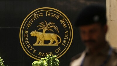 RBI MPC: A police officer walks past the Reserve Bank of India (RBI) logo inside its headquarters in Mumbai, India. (Reuters)