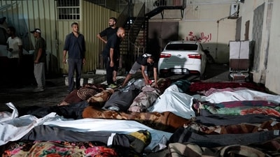 Palestinians check the bodies of their relatives killed in an Israeli bombardment of UNRWA school at Nusseirat refugee camp, in front of the morgue of al-Aqsa Martyrs hospital in Deir al-Balah, central Gaza Strip, early Thursday, June 6, 2024. (AP Photo/Abdel Kareem Hana) Palestinians check the bodies of their relatives killed in an Israeli bombardment of UNRWA school at Nusseirat refugee camp, in front of the morgue of al-Aqsa Martyrs hospital in Deir al-Balah, central Gaza Strip, early Thursday, June 6, 2024. (AP Photo/Abdel Kareem Hana)