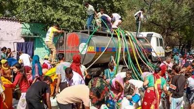 People queue up for water from tanker amid crisis in New Delhi (PTI Photo) People queue up for water from tanker amid crisis in New Delhi (PTI Photo)