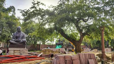 Statues of Mahatma Gandhi and others during relocation within the Parliament premises as part of the redevelopment project. (PTI)