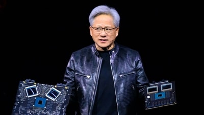 Nvidia's CEO Jensen Huang displays products on-stage during the annual Nvidia GTC Artificial Intelligence Conference at SAP Center in San Jose, California. (AFP)