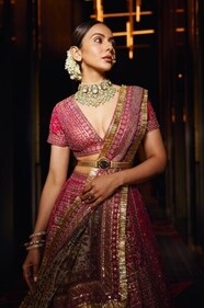 Take inspiration from Rakul for your D-day, who looks bewitching in a red lehenga with mughal inlay motif and paired with a belt from designer JJ Valaya. Her look has been accessorised with exquisite jewellery from the house of Archana Aggarwal Timeless Jewellery, showcasing a captivating blend of polkies, gold, emeralds, and South Sea pearls. (Photographer: Vidhi Godha) Take inspiration from Rakul for your D-day, who looks bewitching in a red lehenga with mughal inlay motif and paired with a belt from designer JJ Valaya. Her look has been accessorised with exquisite jewellery from the house of Archana Aggarwal Timeless Jewellery, showcasing a captivating blend of polkies, gold, emeralds, and South Sea pearls. (Photographer: Vidhi Godha)