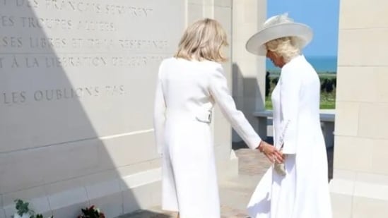 Queen Camilla and Brigitte Macron opted to wear stunning white dresses for the service and laid wreaths of flowers at the British Normandy Memorial at Ver-sur-Mer. (GETTY)