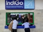 Passengers stand at the ticket counter of Indigo Airlines at the airport on the outskirts of Agartala, capital of India's northeastern state of Tripura,
