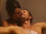 Glen Powell and Adria Arjona in a still from Hit Man.