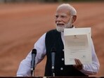 Indian Prime Minister-designate Narendra Modi displays a letter from the President of India, Draupadi Murmu, inviting him to form the next central government, outside the Rashtrapati Bhavan in New Delhi. Indian Prime Minister-designate Narendra Modi displays a letter from the President of India, Draupadi Murmu, inviting him to form the next central government, outside the Rashtrapati Bhavan in New Delhi.