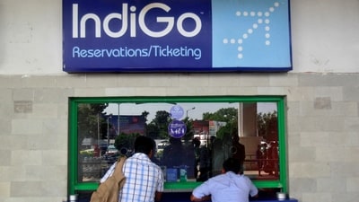 Passengers stand at the ticket counter of Indigo Airlines at the airport on the outskirts of Agartala, capital of India's northeastern state of Tripura, (REUTERS)