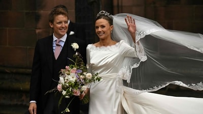 Groom Hugh Grosvenor, Duke of Westminster, and bride Olivia Henson pose for a photograph as they leave after their wedding service at Chester Cathedral in Chester, northern England, on June 7, 2024. (AFP) Groom Hugh Grosvenor, Duke of Westminster, and bride Olivia Henson pose for a photograph as they leave after their wedding service at Chester Cathedral in Chester, northern England, on June 7, 2024. (AFP)