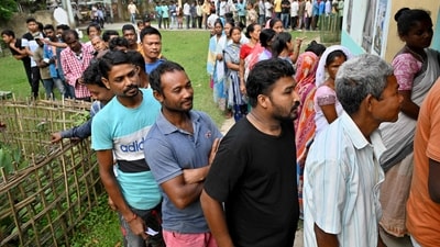 People stand in a queue to cast their votes as voting starts in the first phase of India's general election at a polling station at Nagaon district, in the country's northeastern state of Assam on April 19, 2024. (Photo by Biju BORO / AFP) (AFP) People stand in a queue to cast their votes as voting starts in the first phase of India's general election at a polling station at Nagaon district, in the country's northeastern state of Assam on April 19, 2024. (Photo by Biju BORO / AFP) (AFP)