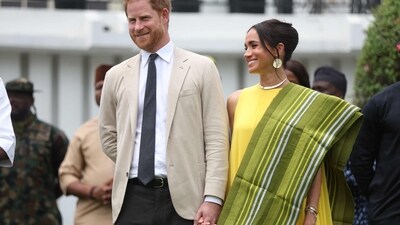 Prince Harry and Meghan Markle blasted for ‘taking advantage’ while royals are unable to conduct overseas tours (Photo by Kola SULAIMON / AFP) (AFP) Prince Harry and Meghan Markle blasted for ‘taking advantage’ while royals are unable to conduct overseas tours (Photo by Kola SULAIMON / AFP) (AFP)