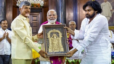 Prime Minister Narendra Modi being presented a memento by TDP chief N Chandrababu Naidu and Janasena Chief Pawan Kalyan during the NDA Parliamentary Party meeting at Samvidhan Sadan, in New Delhi, Friday (PTI) Prime Minister Narendra Modi being presented a memento by TDP chief N Chandrababu Naidu and Janasena Chief Pawan Kalyan during the NDA Parliamentary Party meeting at Samvidhan Sadan, in New Delhi, Friday (PTI)