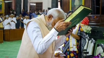 Prime Minister Narendra Modi pays respects to the Constitution of India as he attends the NDA Parliamentary Party meeting at Samvidhan Sadan, in New Delhi, Friday (PTI) Prime Minister Narendra Modi pays respects to the Constitution of India as he attends the NDA Parliamentary Party meeting at Samvidhan Sadan, in New Delhi, Friday (PTI)