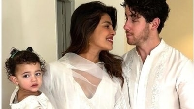 Priyanka Chopra with daughter Malti Marie and husband Nick Jonas during a Holi party in Noida. Priyanka Chopra with daughter Malti Marie and husband Nick Jonas during a Holi party in Noida.