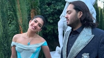 Radhika Merchant turns into a princess in a blue Versace gown with Anant Ambani. (Instagram) Radhika Merchant turns into a princess in a blue Versace gown with Anant Ambani. (Instagram)