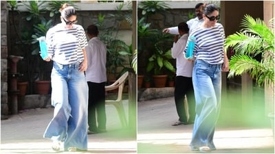 Kareena's jeans features a mid-rise waistline, a fitted silhouette on the hips, a flared hem, and a floor-length hem. The actor accessorised her simple ensemble with slip-on sandals, a diamond ring, and black-tinted broad sunglasses. Lastly, she chose rouge-tinted cheeks, dewy skin, glossy lips, and a back-swept twisted bun to round off the glam picks. (HT Photo/Varinder Chawla) Kareena's jeans features a mid-rise waistline, a fitted silhouette on the hips, a flared hem, and a floor-length hem. The actor accessorised her simple ensemble with slip-on sandals, a diamond ring, and black-tinted broad sunglasses. Lastly, she chose rouge-tinted cheeks, dewy skin, glossy lips, and a back-swept twisted bun to round off the glam picks. (HT Photo/Varinder Chawla)